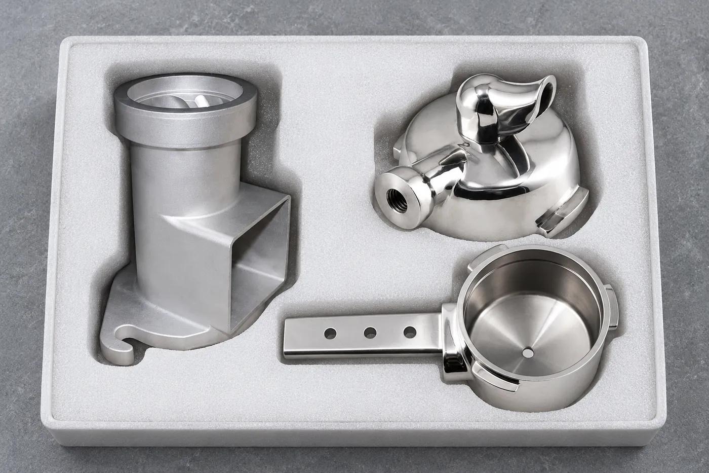 Two aluminum hardware references separated in protective foam