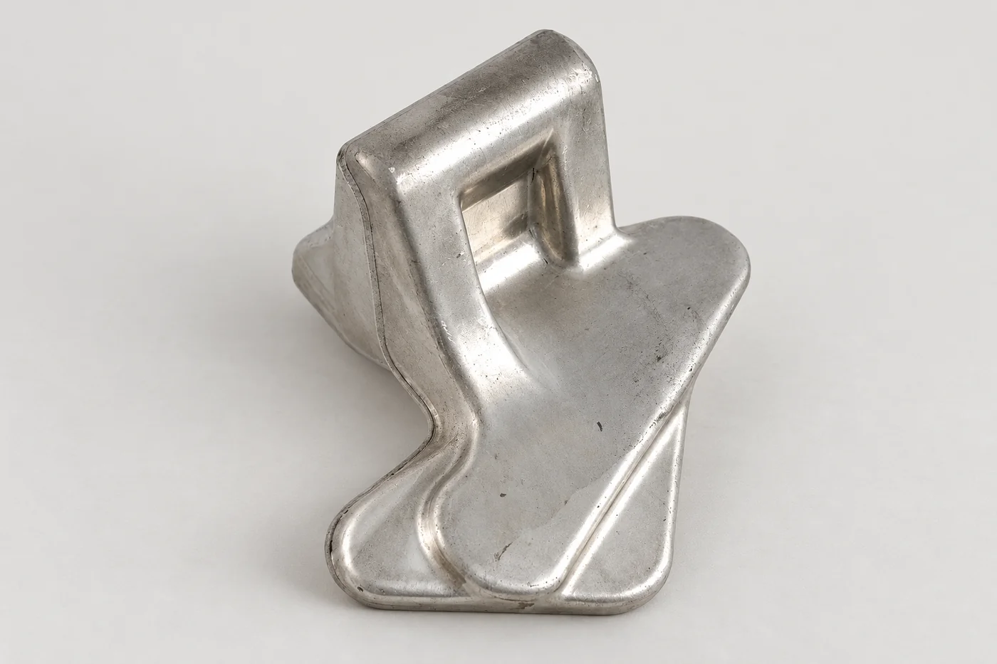 Stainless pivot-adapter bracket with its curved body and mounting geometry