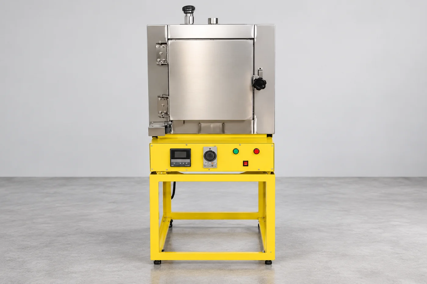 Silver burnout-oven reference on a yellow support frame