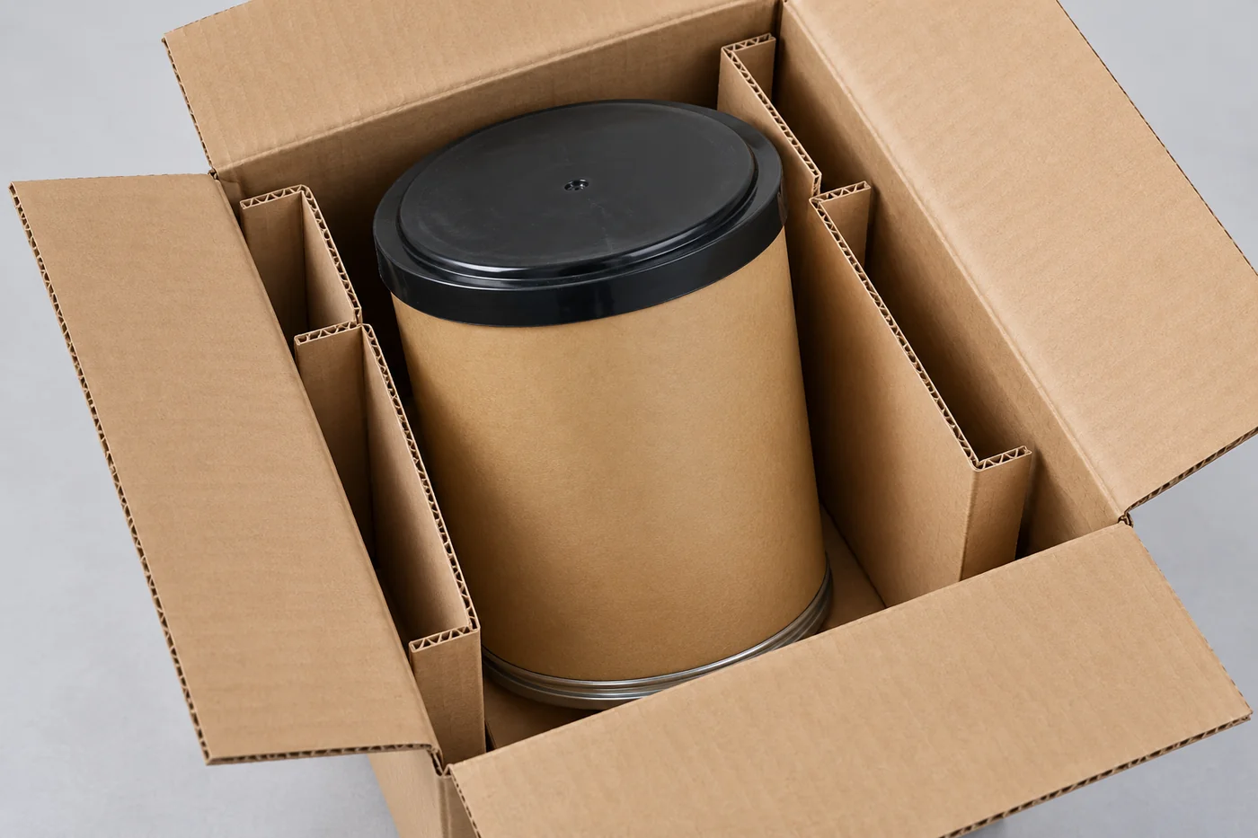Plain investment-powder container protected inside an unprinted carton
