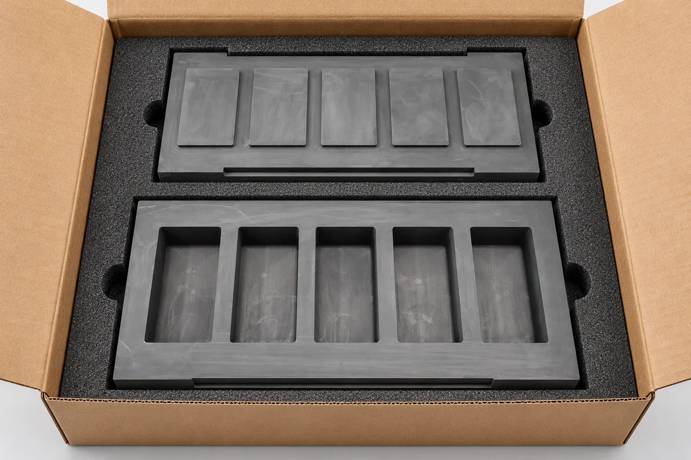 Graphite mould and lid protected in separate foam recesses