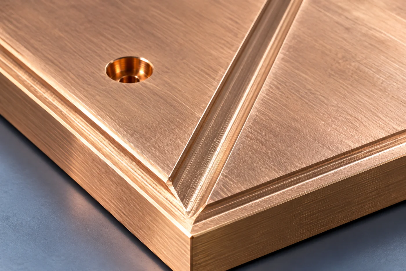 Close view of a brass plate groove and adjoining working face