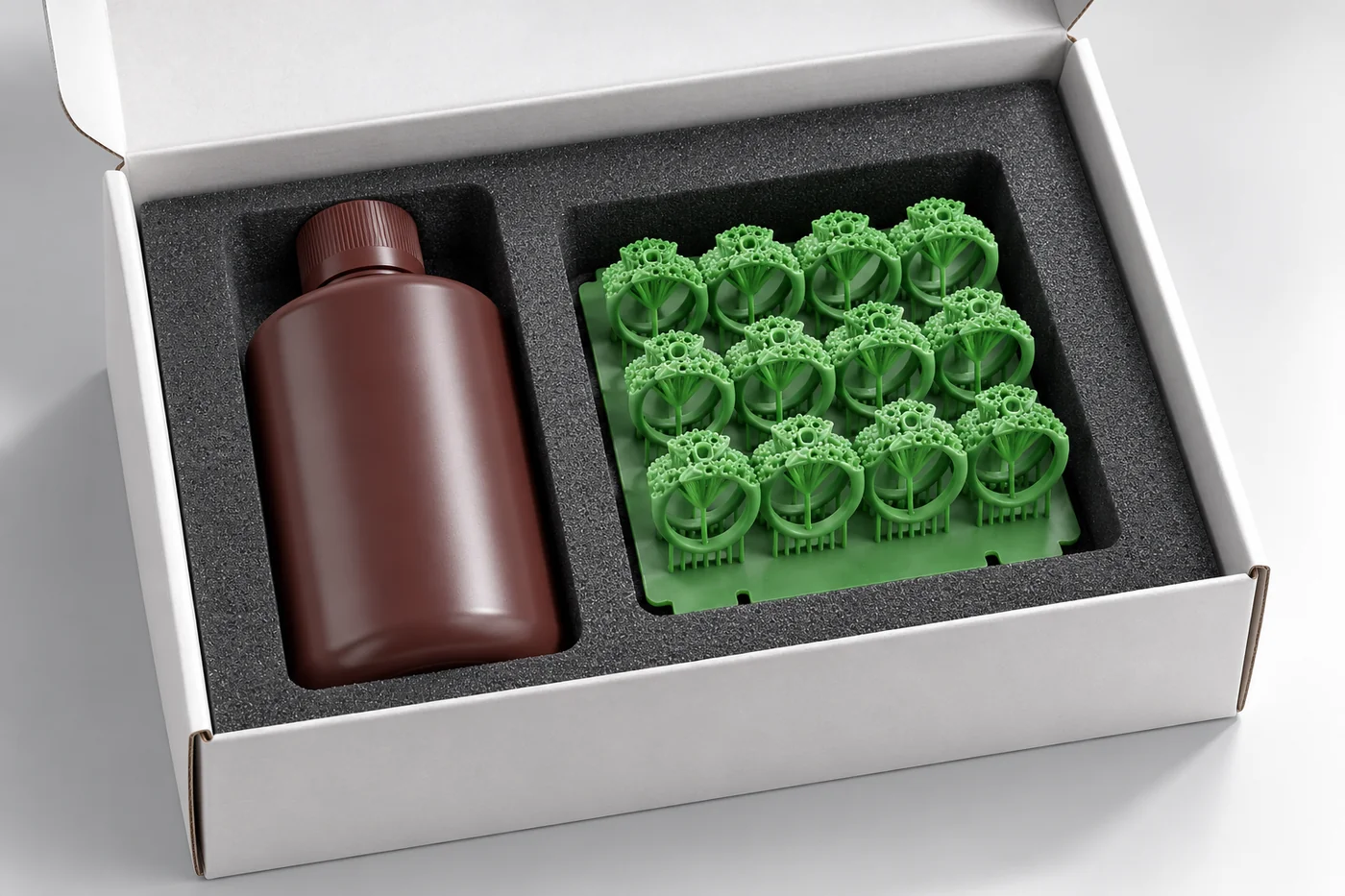 Plain resin bottle secured in a protective carton beside separated pattern samples