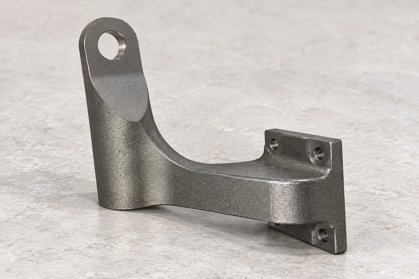 Cast steel mounting bracket with a large eye and machined fastening holes