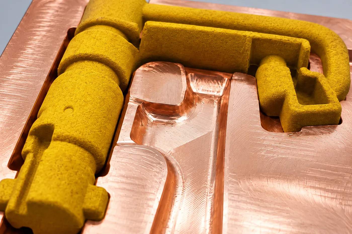 Close view of the faucet-body-shaped mould cavity