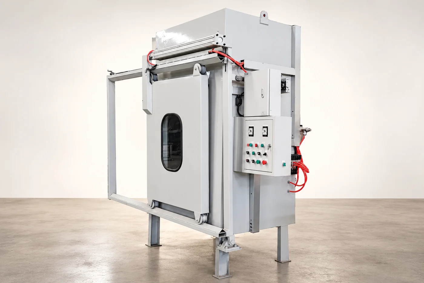 Tall white foundry-equipment reference with its enclosure and tray arrangement