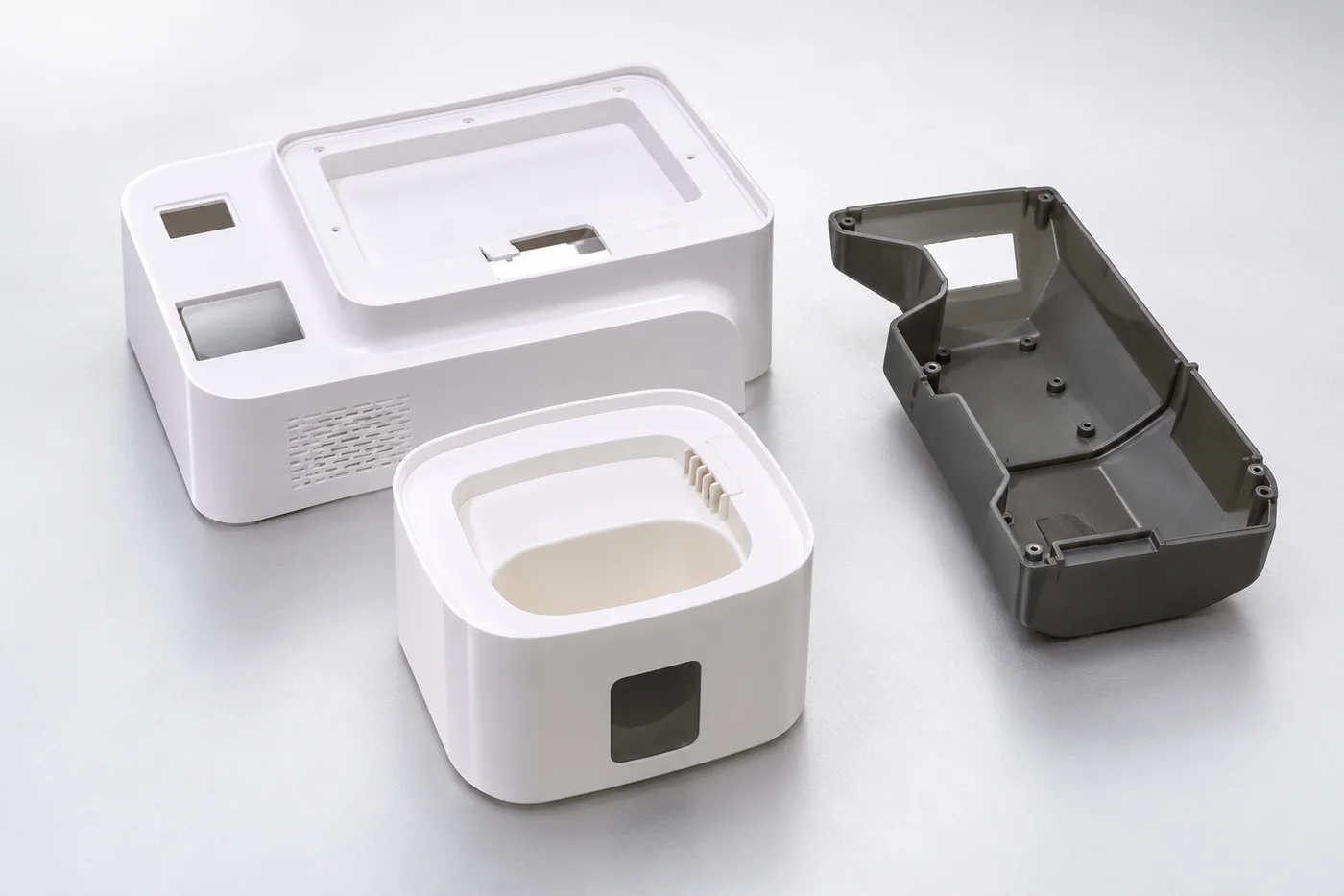 Separate plastic enclosure prototype references in light and dark colours