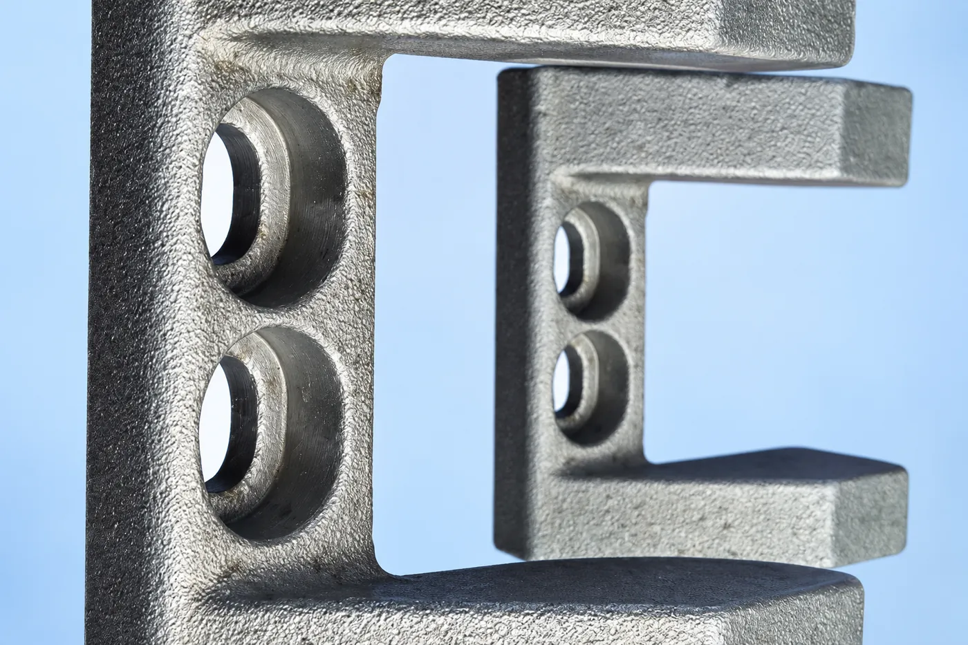 Close detail of a stainless hinge-leaf mounting face and inner step