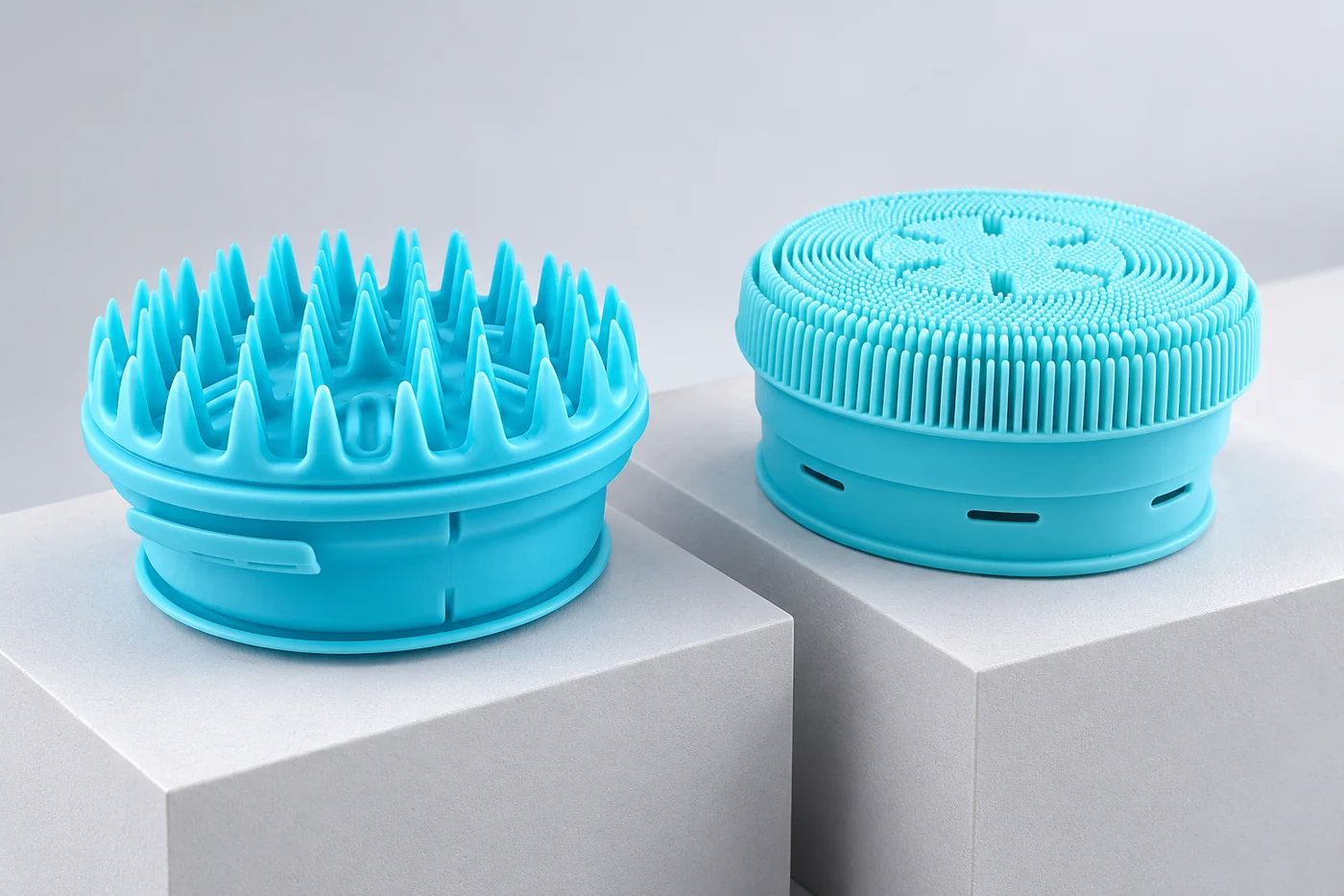 Two blue polymer prototype forms with fine protrusions and round bodies