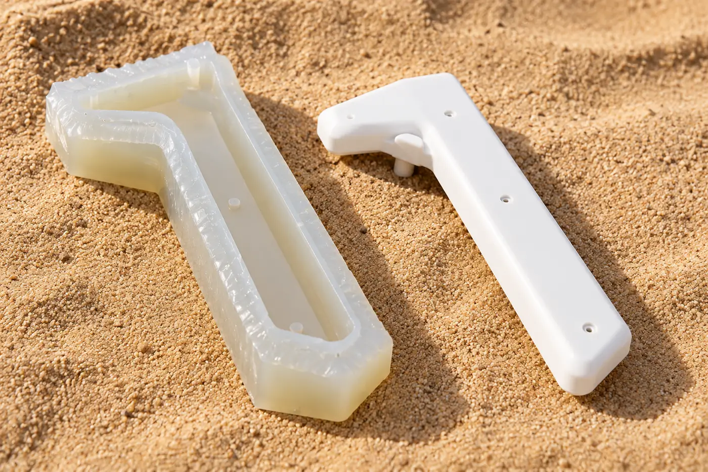White polymer prototype and silicone-mould references shown separately