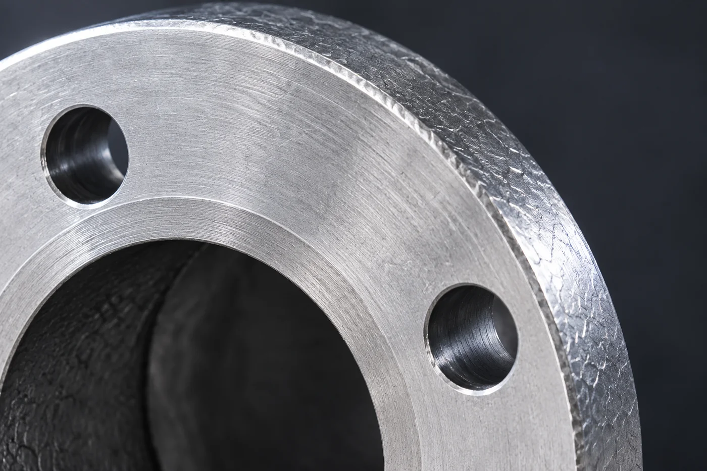 Close detail of a cast valve-body flange and its sealing face